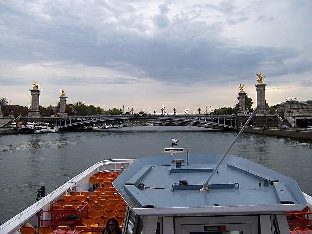 This is one of the 46 bridges over the Seine River in Paris taken tour boat. Hitler had ordered every bridge be blown and Paris be left a pile of rubble.