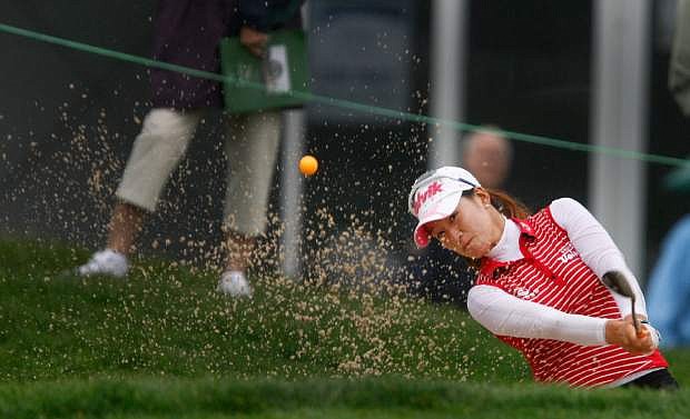 Chella Choi hits from the sand on 18th hole during the first round LPGA Championship golf championship, Friday, June 7, 20123, in Pittsford, N.Y. (AP Photo/Democrat &amp; Chronicle, Shawn Dowd)  MAGS OUT; NO SALES