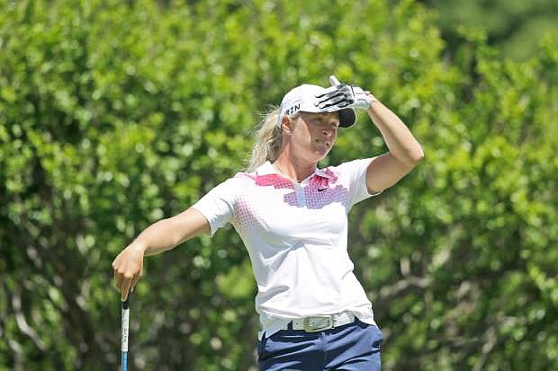 Suzann Petterson of Norway watchers her tee shot on the second hole during the third round of the North Texas LPGA Shootout golf tournament at the Las Colinas Country Club in Irving, Texas, Saturday, May 3, 2014. (AP Photo/LM Otero)