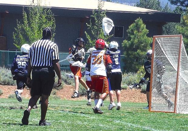 Oasis Bighorns lacrosse goalie Kaden Stone makes a save during the Bighorns&#039; 10-1 win over Truckee on Saturday.