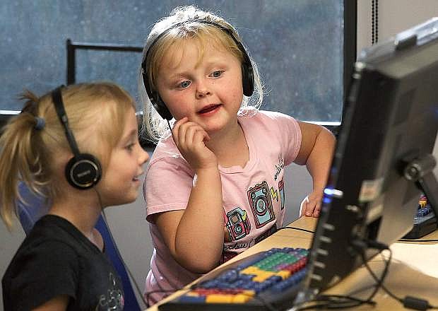 Alexa Manies and Kelli Ann Plautz, both 5, play in the youth area of the Carson City Library in this file photo from Oct. 23, 2014. The Carson City Leadership Class of 2015 is hosting a fundraiser at Applebee&#039;s 5-8 p.m. Feb. 25. Applebee&#039;s will donate 15 percent of the night&#039;s proceeds to improve the children&#039;s area at the library, patrons must present the flier.