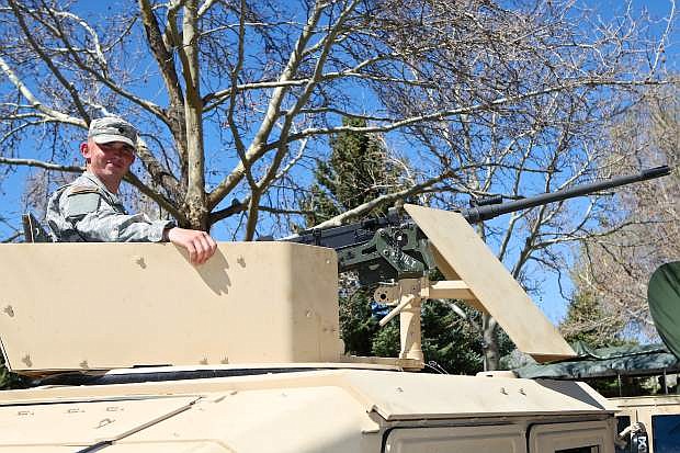 Army Spc. Tyler George of Yerington mans his M1151 Humvee with mounted M2 .50 caliber machine gun Thursday in the Capitol Plaza.