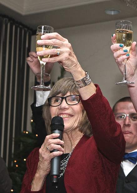 Carson City Library Trustee Chair Sandy Foley toasts Black &amp; White Ball partygoers and the new year Wednesday night in Carson City.