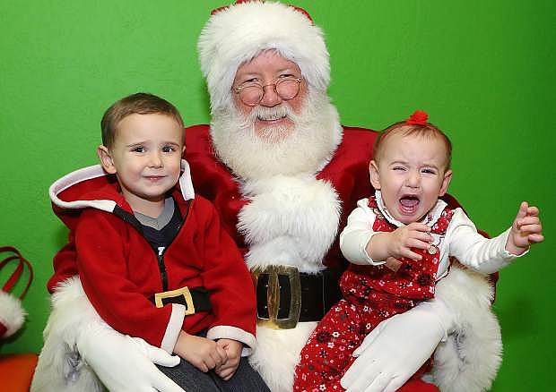 Samuel and Clara Papez, 3 and 1, visit Santa during Storytime at the Carson City Library, in Carson City, Nev., on Thursday, Dec. 17, 2015.