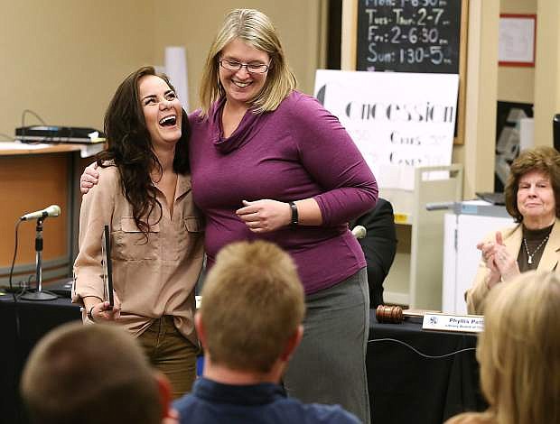 Kayla Homme, left, hugs Carson City Library Director Sena Loyd after receiving her Manufacturing Technician Level 1 certificate during a brief ceremony at the library in Carson City, Nev., on Thursday, Oct. 22, 2015. Homme is one of the first three graduates from the library&#039;s accelerated program.