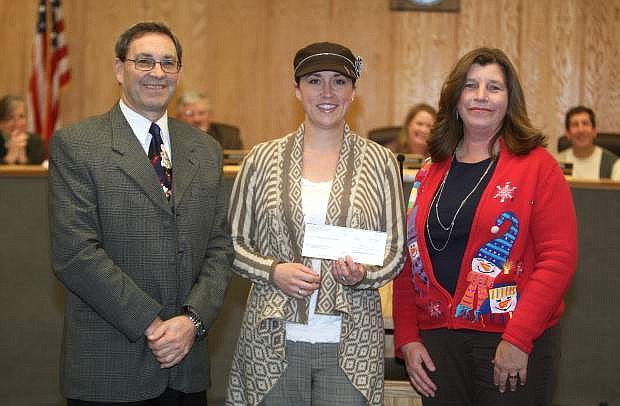 Nevada Appeal retail advertising manager Tonya Champa, center, presents a $1,800 check to Carson City School Board president Stacie Wilke and school superintendent Richard Stokes to benefit the district&#039;s Success for All reading program. The money was raised through the Nevada Appeal&#039;s Literacy for Life campaign.