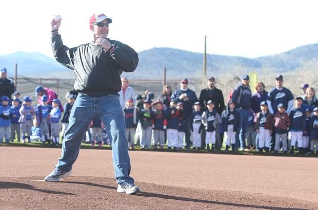 Cory Fowler throws the first pitch of the season during Silverada Little League opening day in Dayton.
