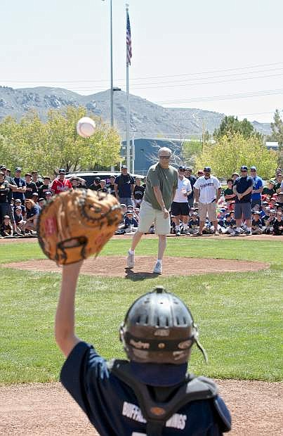 Doak Davis, longtime league volunteer and &#039;Challenger&#039; program head throws in the first ball at Carson City Little League opening ceremonies Saturday afternoon at Governor&#039;s Field.