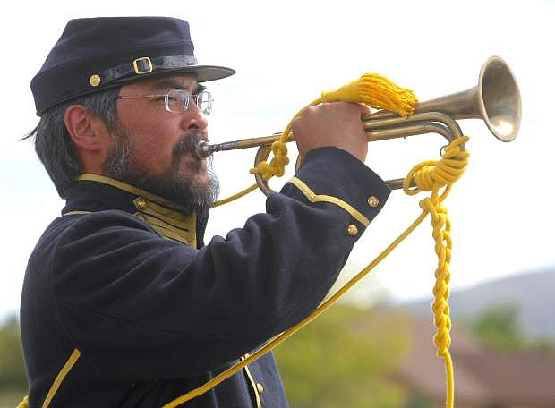 Peter Springer plays &quot;Taps&quot; at the Memorial Day ceremony held at the Stewart Indian Cemetery on Monday.