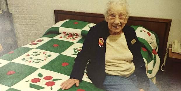 Maysie Lord, who celebrated her 100th birthday yesterday, shows off her quilt work.
