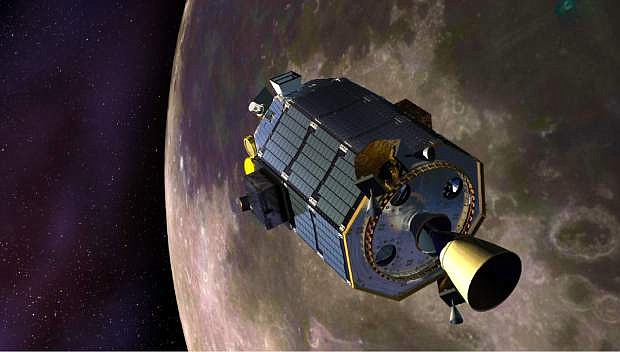 In this artist&#039;s concept provided by NASA, the Lunar Atmosphere and Dust Environment Explorer (LADEE) spacecraft orbits the moon. Flight controllers on Friday, April 18, 2014 confirmed that the orbiting spacecraft crashed into the back side of the moon as planned, just three days after surviving a full lunar eclipse, something it was never designed to do. (AP Photo/NASA, Dana Berry)