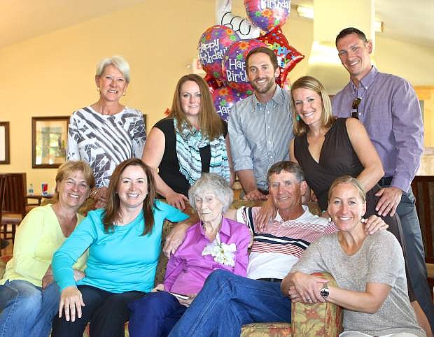 Mildred &#039;May&#039; Lyman (center, in pink) poses for a photo with her family at her 100th birthday party Saturday at Skyline Estates Senior Living. Mildred Lyman was born 5/9/1915 and is the middle child of 7 siblings, 4 girls, Lottie, Vera, Cathryn and Rita and 3 brothers Amilcar, Arnold &amp; Arthur.