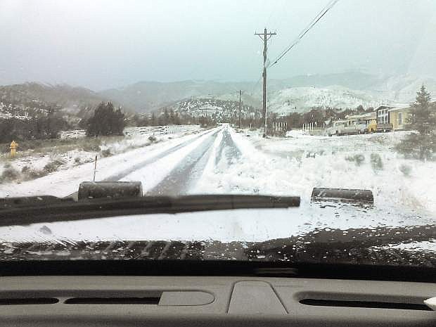 Lyon County road crews clear hail from the roads in western Lyon County.