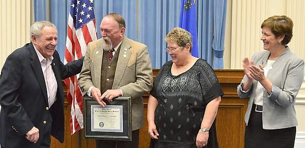 Nevada Veterans Services Commissioner Chuck Harton, se3cond from left,  congratulates fellow Marine GunnyJame  Utterback. Looking on are  Denise Utterback (second from right) and Director Kat Miller