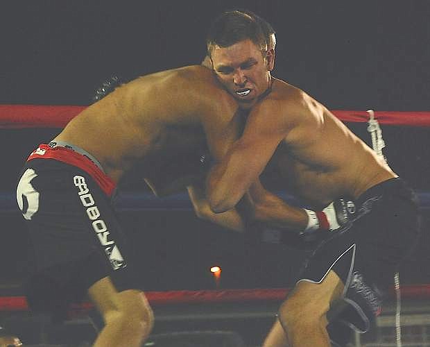 Fallon&#039;s Cody Downs, right, grapples with Gardnerville&#039;s Gio Mackey during their mixed-martial arts fight on Saturday at the Churchill County Fairgrounds. Mackey won by a knockout in the first round.