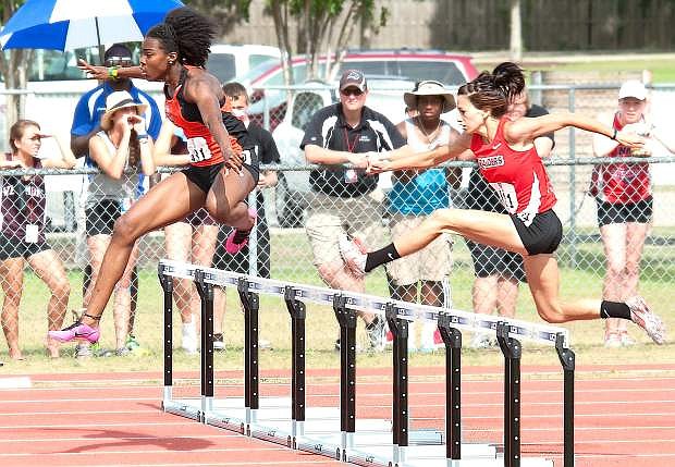 Fernley product Amelia Maguin, right, runs to a second-place finish for Southern Oregon University in the women&#039;s 400-meter hurdles at the recent NAIA Outdoor Track and Field Championships at Mickey Miller Blackwell Stadium in Gulf Shores, Ala. Maguin clocked a time of 59.19 seconds to break her own school record for the third straight meet.