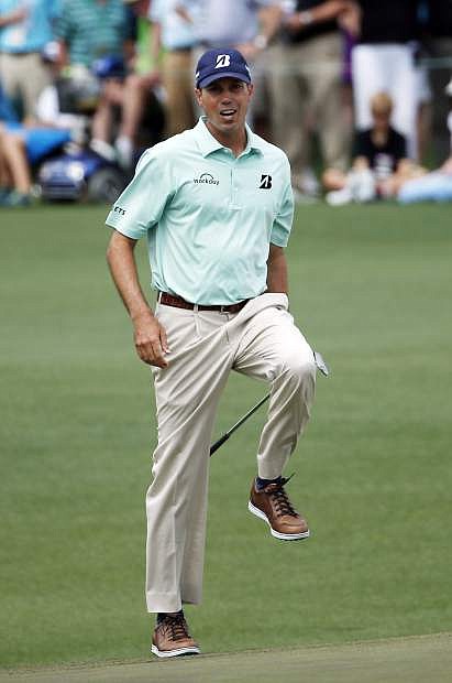 Matt Kuchar reacts as he narrowly misses a putt on the second green during the fourth round of the Masters golf tournament Sunday, April 13, 2014, in Augusta, Ga. (AP Photo/Matt Slocum)