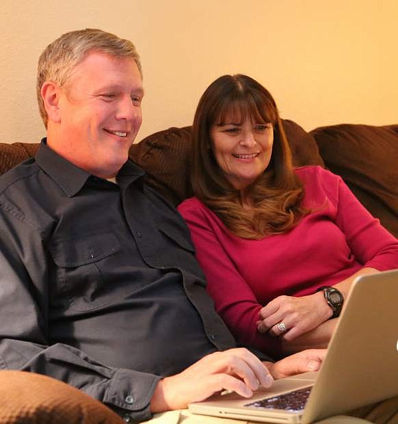 Carson City Mayor candidate Chris Carver looks at election results with his wife Lori on Tuesday night.