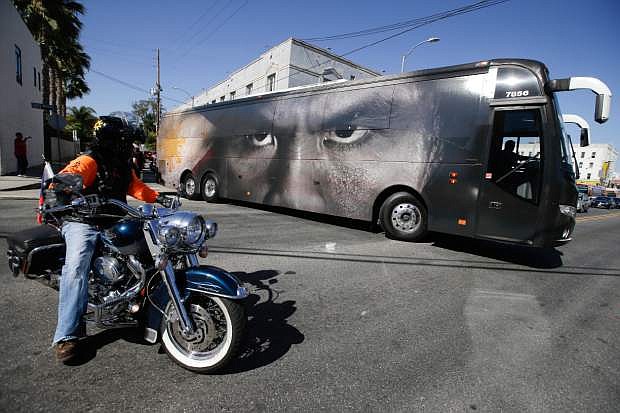 A tour bus carrying guests and members of boxer Manny Pacquiao&#039;s training camp leaves for Las Vegas, Monday, April 27, 2015, in Los Angeles. Pacquiao is scheduled to fight Floyd Mayweather Jr. in a welterweight boxing match in Las Vegas Saturday. (AP Photo/Jae C. Hong)