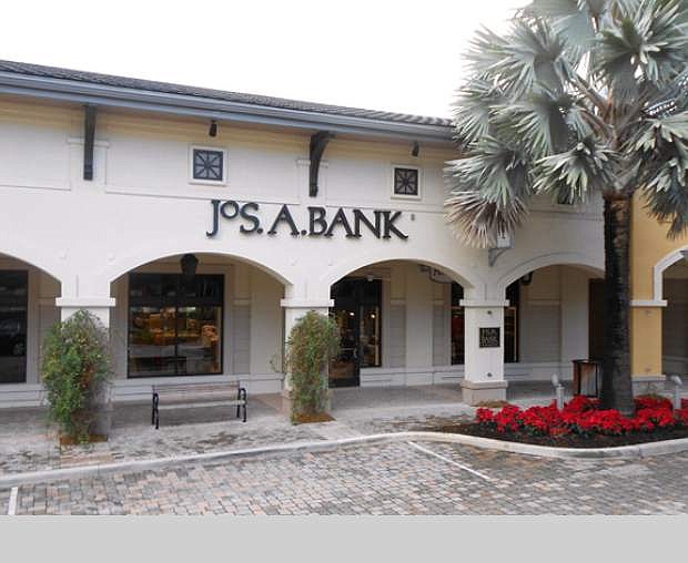 This undated photo provided by JoS. A. Bank, shows a JoS. A. Bank store at the Shops at Midtown Miami in Miami, Fla. As of Tuesday, Nov. 26, 2013, Men&#039;s Wearhouse is turning the tables on its recent pursuer, offering to buy Jos. A. Bank for approximately $1.54 billion. The offer comes less than two weeks after Jos. A. Bank withdrew its $2.3 billion bid for its rival. (AP Photo/JoS. A. Bank)
