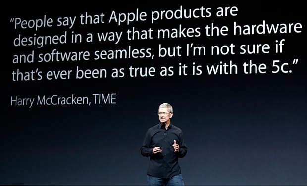Apple CEO Tim Cook speaks on stage before a new product introduction on Tuesday, Oct. 22, 2013, in San Francisco. (AP Photo/Marcio Jose Sanchez)