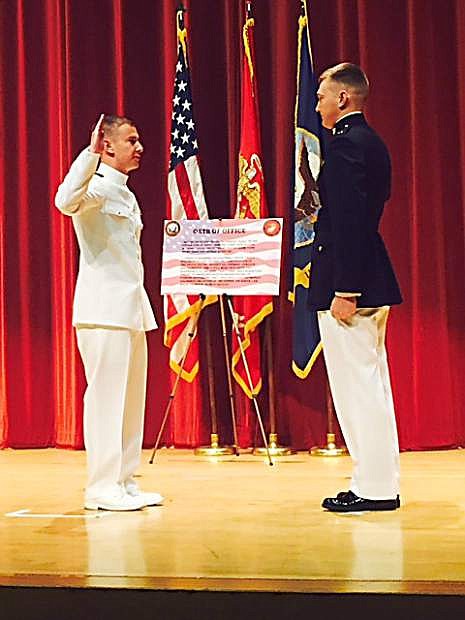 Evan Richards, left, is administered the Oath of Office by his brother, Marine Corps 2nd Lt. Andrew Richards.