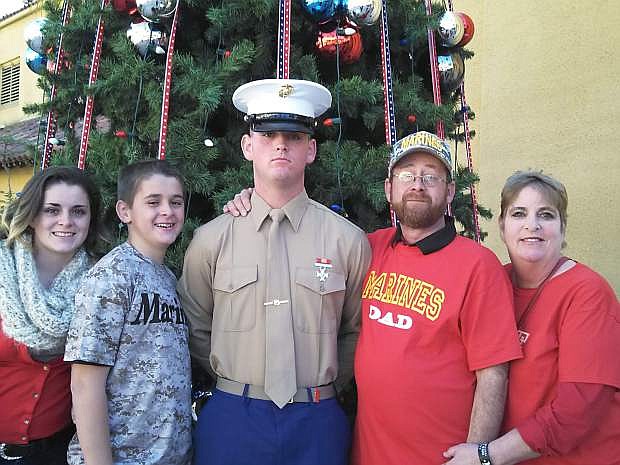 Marine Corps graduate Kyle Bell is pictured with his sister Kierra, brother Connor, and parents Mike and Lisa.