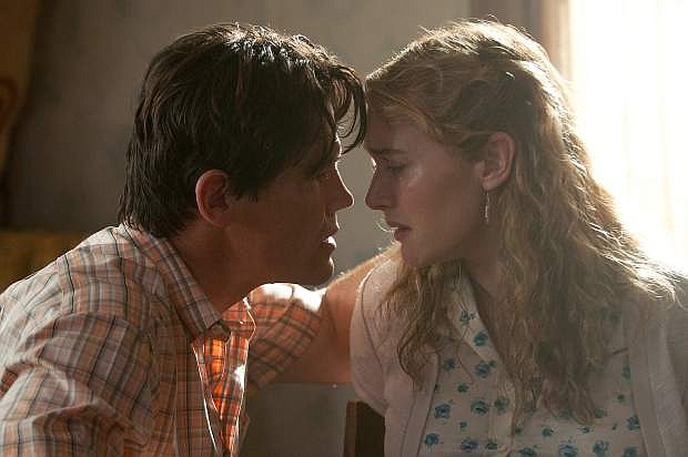This image released by Paramount Pictures shows Josh Brolin, left, and Kate Winslet in a scene from &quot;Labor Day.&quot;