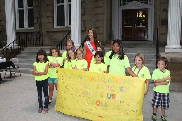 Nia Sanchez, Miss USA, poses with children from the Boy&#039;s and Girl&#039;s Club of Carson City on Wednesday.