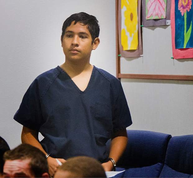 Adrian Navarro-Canales, 16, appears in Henderson Justice Court, in Henderson, Nev. Monday, Sept. 30, 2013,  on charges that he killed his mother and younger brother a day after celebrating his 16th birthday. Navarro-Canales is being prosecuted as an adult in the case.  (AP Photo/Las Vegas Review-Journal, Jeff Scheid)