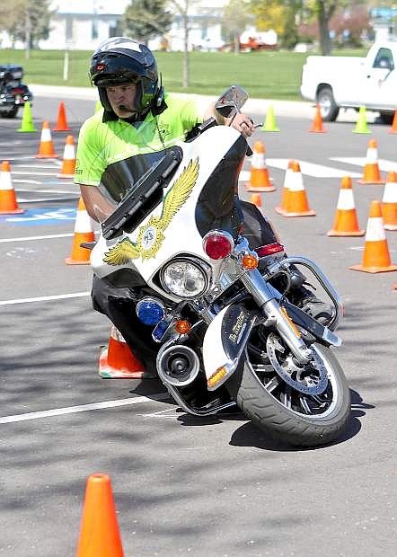 CCSO Deputy Derrick Kepler practices for the Extreme Motor Officer Training Challenge Wednesday. The event will be held June 23rd-25th at Mills Park.