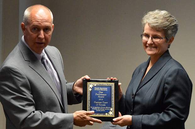 NACE President Steve Tuttle presents the Star Award to State Court Administrator Robin Sweet in Carson City.