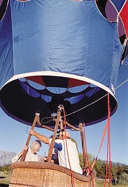 Belinda Grant Photo/Nevada Appeal News servicePilot Gary Peterson helps 100-year-old Lourinda Wines board a hot air balloon Saturday morning.