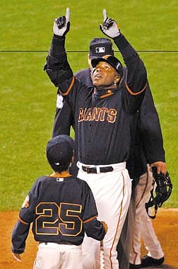 San Francisco Giants&#039; Barry Bonds celebrates his 72nd home run of the season at home plate, against the Los Angeles Dodgers at Pacific Bell Park in San Francisco, Friday, Oct. 5, 2001.  (AP Photo/Justin Sullivan)