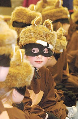 Matthew Agnew, 7,  plays one of the raccoons in the Little Red Riding Hood play at Fremont Elementary Friday afternoon during a rehearsal.  He was waiting backstage.   photo by Rick Gunn