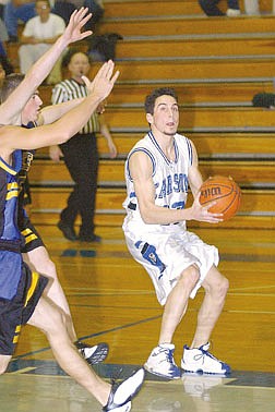 Brian CorleyAdam McKenzie of Carson sets for a shot against Reed on Friday.