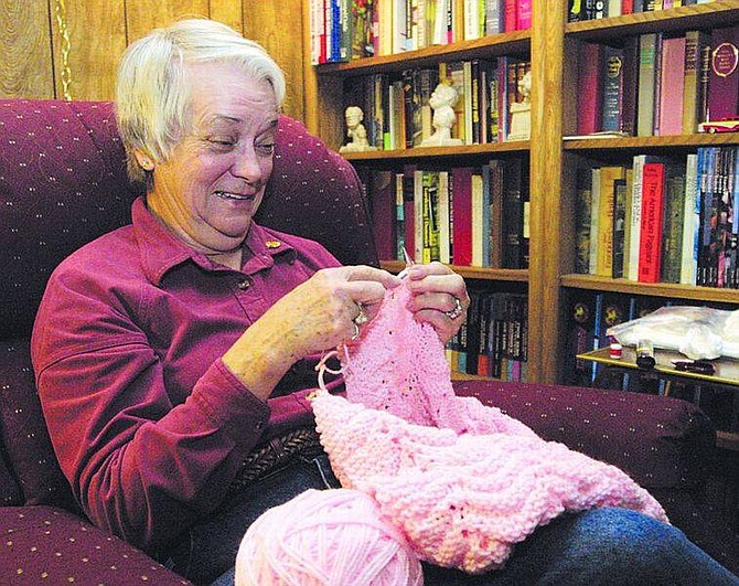 Cathleen Allison photo.Donna Peak, of Indian Hills wants to knit afghans for 17 babies born fatherless in wake of the Sept. 11 attacks on the World Trade Center. She is looking for people to help her complete this labor of love.&#124;
