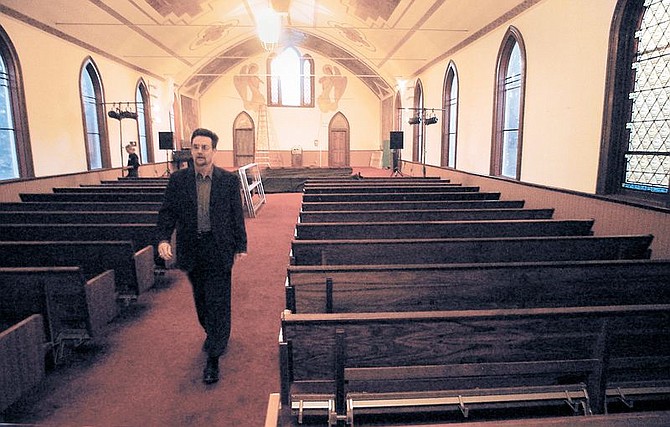 Brewery arts Center Director Joe McCarthy walks through the former St. Theresa&#039;s of Avila Church that the BAC purchased recently.  The Church is being renovated to become a performing arts center with a goal to keep the best of its current attributes like acoustics, and seating proximity which allows the audience to remain closer to the stage.  photo by Rick Gunn