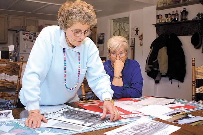 Bonnie Boice Nishikawa and her sister, Ella Boice Fowlkes look at photos of their former home, the Northern Nevada Children&#039;s Home. The sisters used to set bowling pins in Carson City&#039;s first bowling alley on the Children&#039;s Home site. The bowling alley building was recently torn down.