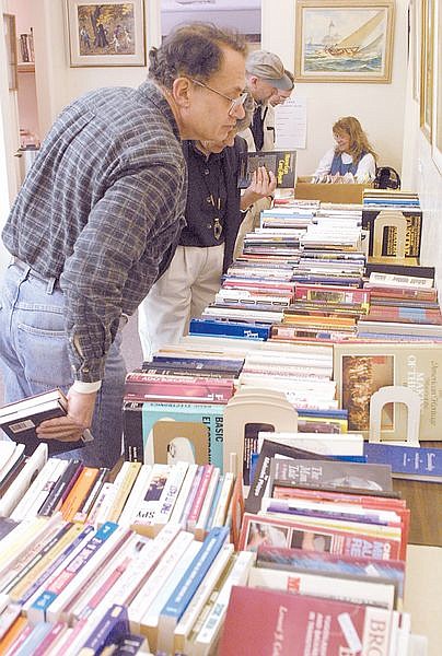 Paul Strohm, of Silver Springs, looks over books at the Carson City Library&#039;s Brower&#039;s Corner sale Monday. Through Saturday, all books at the Browser&#039;s Corner are half off. Photo by Cathleen Allison