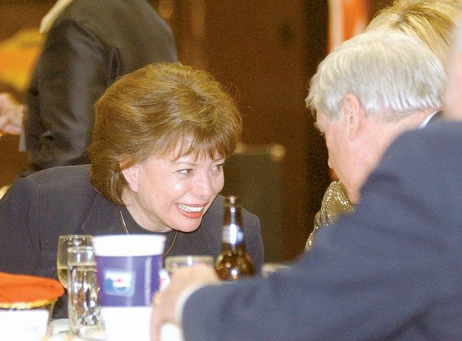 Helen Chenoweth-Hage, left, talks with Gov. Kenny Guinn during the Republican Licoln Day Dinner held at the Carson Nugget Friday. Photo by Brian Corley