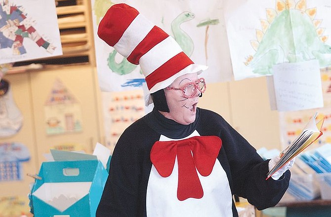Gene Brown, instructional assistant at Bordewich-Bray Elementary School, read &quot;Green Eggs and Ham&quot; to kindergarten  students Friday dressed as the Cat In the Hat. She read to several classrooms in celebration of Read Across America month in honor of Dr. Seuss&#039; birthday today.
