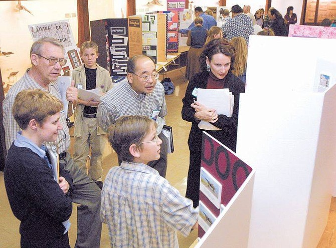Cathleen Allison photoRyan Walsh, 12, from Dayton Intermediate School, explains his Munt Rushmore research to judges on Sataurday during Nevada History Day competition at the Nevada State Museum. Left to right are judges Jessica Miller, Bill Metscher, Gene Hattori and Nora James. Eric Darragh, 13, waits his turn.