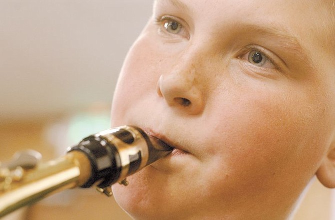 Seeliger Sax player Joshua Barbie, 9, practices with his bandmates for a performance at Carson High School.