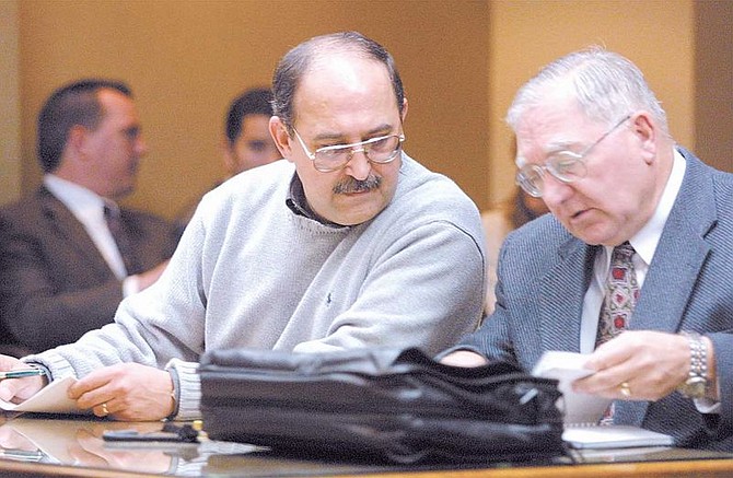 Depresssurized Technologies, Inc. owner Walter Gonzalez, left, talks with his attorney Noel Manoukian in East Fork Justice Court on Wednesday morning.  Gonzalez faces charges stemming from the Sept. 17, 2001 explosion at his Minden plant that killed one employee and injured four others.