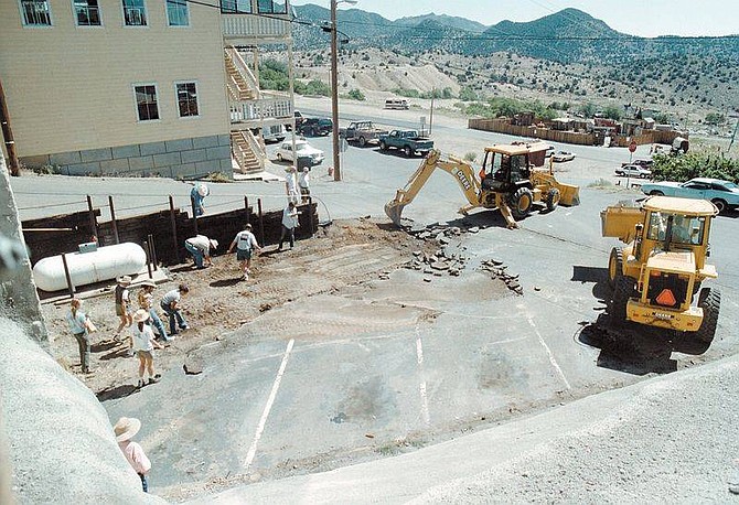 Photo by Bill HusaUniversity of Nevada, Reno archeology students along with volunteers awaited the removal of the blacktop behind the Bucket of Blood Saloon in this July 2000 photo. The group found remains of the Boston Saloon, an African American business that thrived in Virginia City.