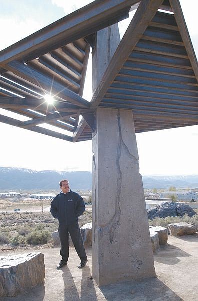 Open Space Manager Juan Guzman stands next to a shade structure at the recently improved open space property above Edmonds Drive overlooking Carson City and the Carson River area.
