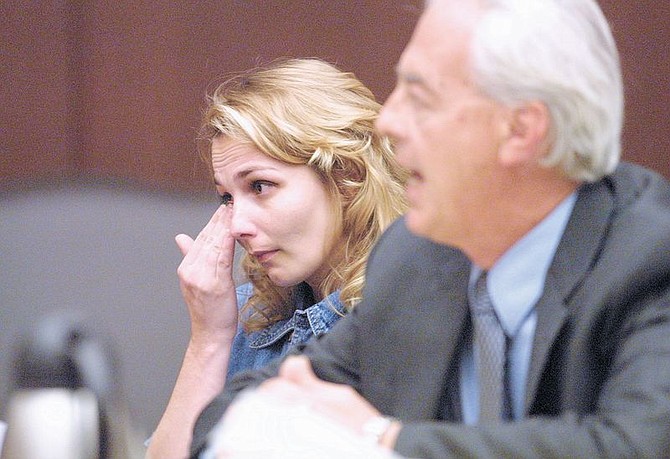 Convicted killer Sandy Shaw listens to her attorney William Terry talk to the Nevada Board of Pardons on Thursday afternoon, June 6, 2002 at the Supreme Court in Carson City.  Shaw has spent the last 16 years in prison for the Show-and-Tell killing of James Cotton Kelly in 1986 in Las Vegas.  The board denied Shaw&#039;s request for clemency.