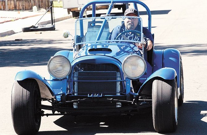 Dave Dunbar Jr. cruises down the street in his restored 1938 Ford Roadster. Dunbar&#039;s father, Dave Sr., won the Sports Car Club of America Pacific Points Championship in 1964 in this car, the Fubar Special.
