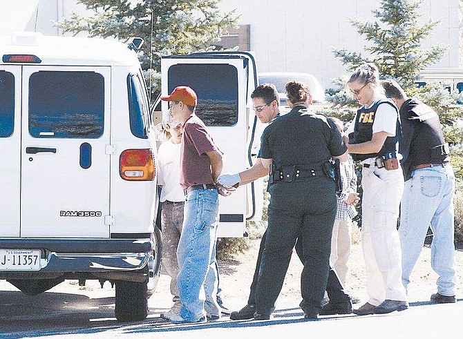 Photo by Rick GunnFBI and INS agents detain suspected illegal immigrants at a business in Carson City&#039;s Industrial park on Tuesday morning.